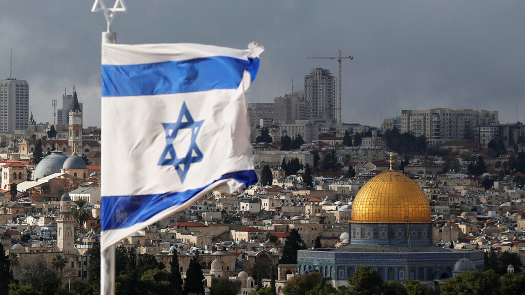 An Israeli flag is seen near the Dome of the Rock, located in Jerusalem’s Old City on the compound known to Muslims as Noble Sanctuary and to Jews as Temple Mount